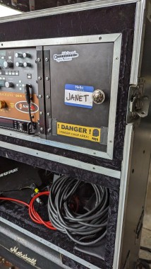 Picture of a road case.  Name tag says Janet.  Warning label says "Danger finger chop area"