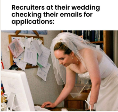Girl in wedding dress checking her email