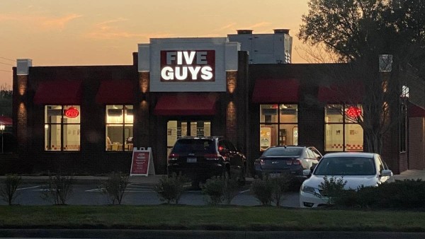 A Five Guys restaurant. On the sign, there's two letters burned out, so it reads:
  IV 
GUYS