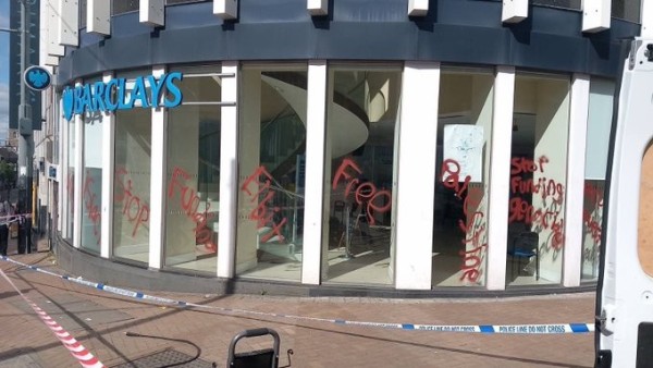 Glass frontage of Barclays sprayed with STOP FUNDING ELBIT 
FREE PALESTINE 
STOP FUNDING GENOCIDE 