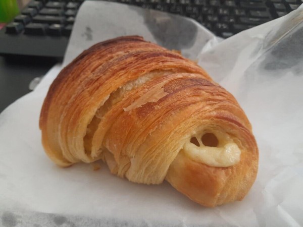 a cheese stuffed croissant, flakey, cheesy and buttery.