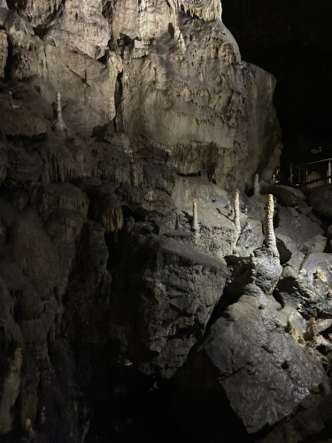 Stalagmites lit in a cave
