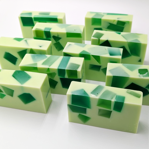 Bars of green soaps on a white background