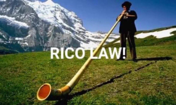 An alpine hornsman blowing, with the caption RICO LAW!