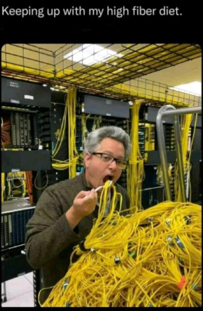 A photo of a man eating a pile of cables like a spaghetti with the caption "Keeping up with my high fiber diet"