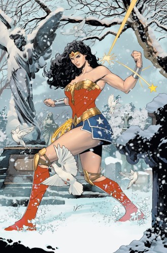 A page from the comic. Wonder Woman stands in a graveyard, deflecting a bullet from wrist band.