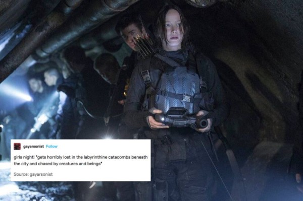 A screenshot of Katniss, a girl wearing a tactical suit, with arrows strapped to her back and remote in her hand, with the text: girls night! *gets horribly lost in the labyrinthine catacombs beneath the city and chased by creatures and beings*