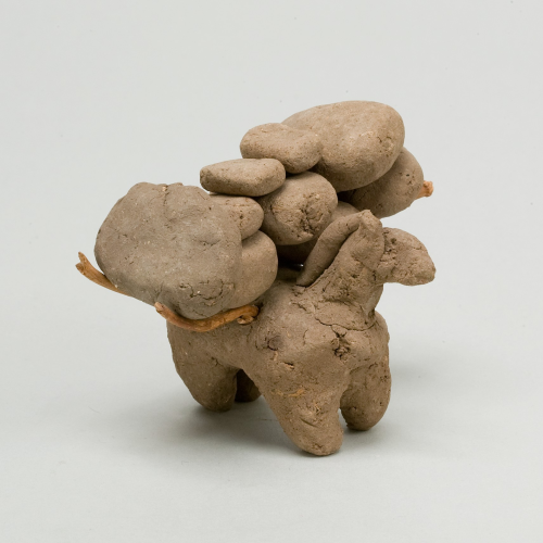 Terra cotta figuring of a donkey overburdened by packs. ca. 1991–1450 BCE, held by the Met, pilfered from Egypt