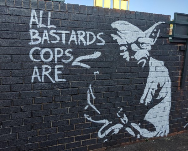 Stencil graffiti of Yoda saying: All Bastards Cops Are.