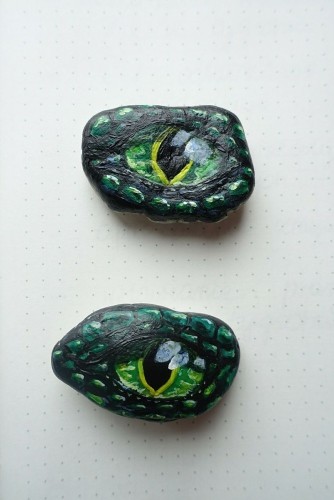 dragon eyes painted on two stones
