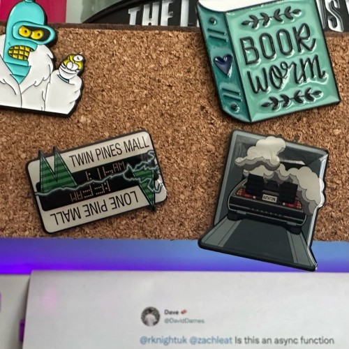 Two Back to the Future pins on a pinboard. Bender from Futurama is visible in the top left as well.