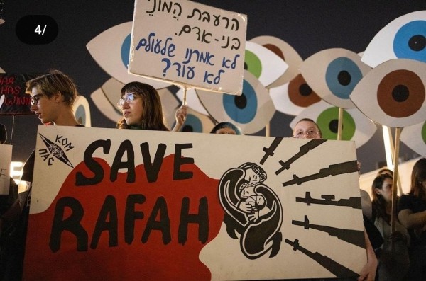 Israelis hold a “Save Rafah” banner