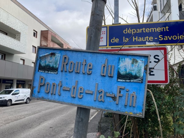 A road signpost for Route du Pont-de-la-Fin with stickers saying « back to Europe » added to it. There weren’t there last time I came in 2020 during lockdown.