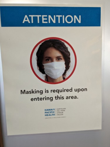 Sign saying Masks Required In This Area