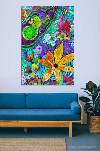 Colorful art featuring a big yellow flower, pink hearts and purple and green cells by artist Sharon Cummings.