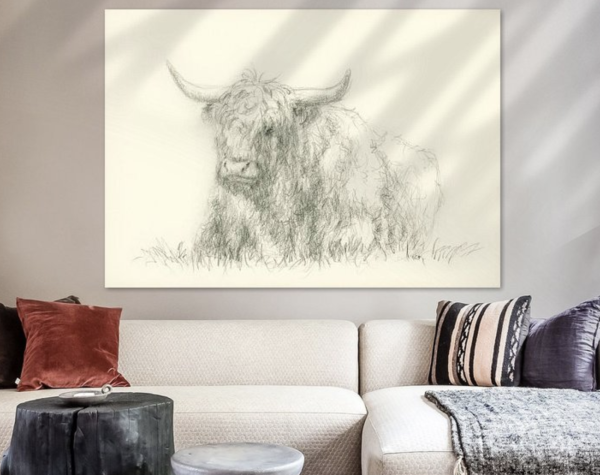 Resting Highland Cattle is a detailed pencil drawing showing a shaggy Highland cattle with distinctive horns and the typical long-haired pony over its eyes, resting in a meadow. The bull is relaxed and calmly lookes ahead. The artwork captures the texture of the cow's coat and the calm facial expression with fine pencil strokes.
The painting hangs above a sofa.