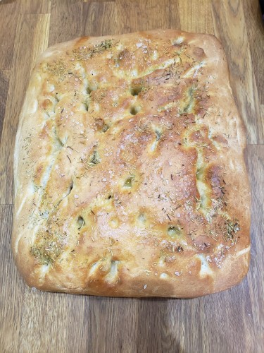 A rosemary and sea salt focaccia with loads of olive oil on it while warm to soak in. I made it a little while ago. It's quite huge but was offered to my neighbours,  none of it went stale let alone went to waste.
