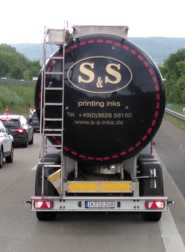 Rear view of a tanker truck with labeling "S&S Printer Ink".