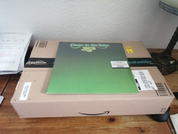 A massive box containing a single LP.