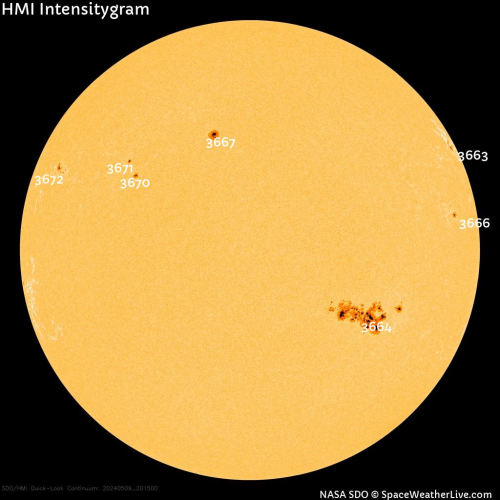 View of the sun showing a gigantic sunspot region labeled 3664
