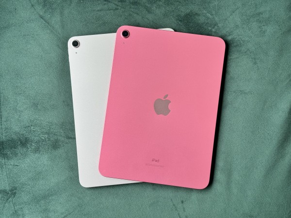 Overhead photo of two iPads sitting on top of each other. One is very pink and the other is just a hint of pink.