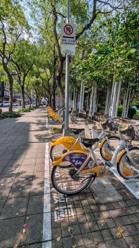 A row of share-bicycles. Rates are already cheap, but most local governments still give subsidies, to promote further use.