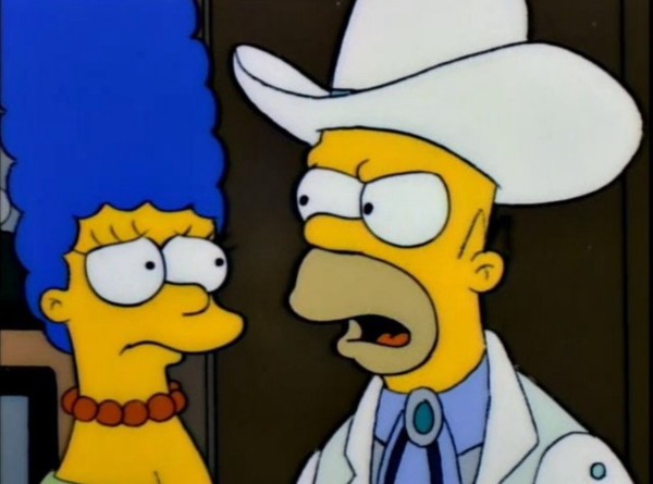 Scene from The Simpsons where Homer says, “Marge, it takes two to lie...one to lie and one to listen.“

Literally, it’s: A cartoon image of two animated characters, one with blue hair and a pearl necklace looking concerned, and the other wearing a white cowboy hat, a lab coat, and a bolo tie, speaking emphatically.