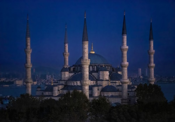 Against a darkening sky, the spires of the Blue Mosque still glow. Thme largest dome is still prominent as are the touched of gold topping each minaret.