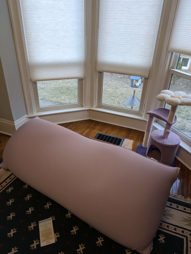 a 6 foot long, 2 foot wide bean bag chair in lavender