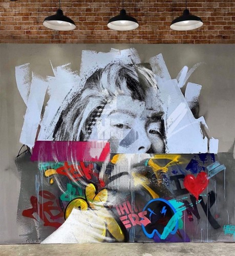 A mixed media mural featuring an Asian woman surrounded by graffiti elements.