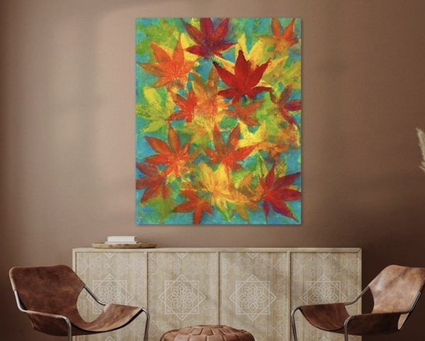 Colorful maple leaves is an acrylic painting in vertical format painted by artist Karen Kaspar. Colorful maple leaves in all rainbow colors yellow, orange, red, green, blue and purple are happily dancing across the paper in this acrylic painting.
The painting hangs in a living room.