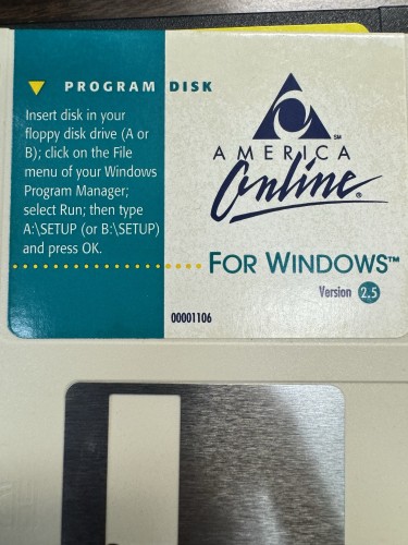 A 3.5-inch floppy disk for America Online (AOL) Version 2.5 for Windows, with installation instructions printed on the label.