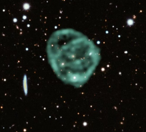 Image of Odd radio circle ORC J2103-6200 from 2022 by the MeerKAT telescope superimposed on an optical image from the Dark Energy Survey.

From Wikicommons:

https://commons.wikimedia.org/wiki/File:ORC_J2103-6200_2022.jpg
