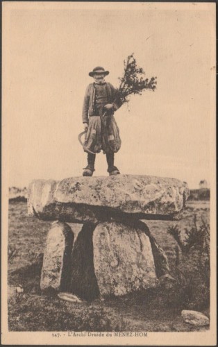 A vintage postcard showing the Arch-Druid of Ménez Hom with sickle in hand standing atop the prehistoric Dolmen du Ménez-Lié in Brittany.