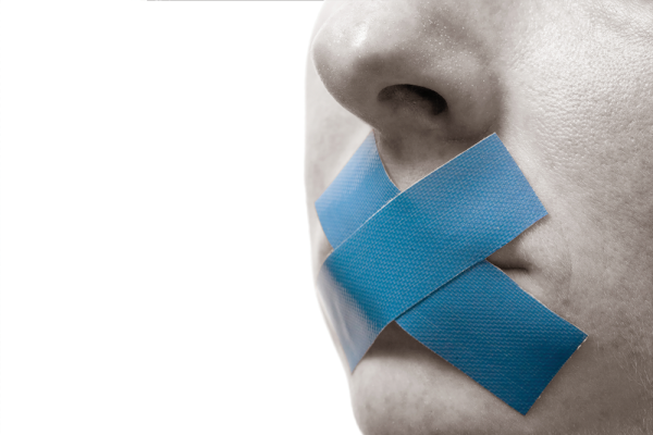 photo of a person's face with an X made of blue tape over their mouth