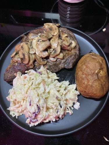 My sister made us steaks on the grill smothered in mushrooms. Baked potato and homemade slaw. I forgot to take a pic before I loaded my potato! 