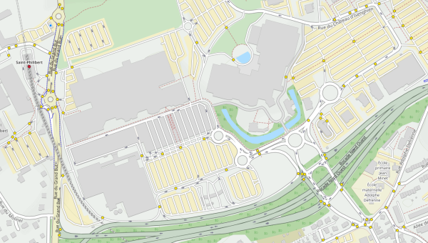Carte OpenCycleMap de la zonne commercial du grand But à Lomme. On y voit de très grands bâtiments et parkings, la station de métro St-Philibert. Mais aucun parking vélo.