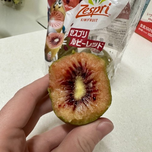 A variety of kiwifruit called ruby red, where the seeds are blood red and the fruit is kind of orange, while the skin is the standard green of normal kiwis, only thinner and less fuzzy. 