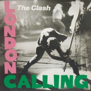 Record cover 
London Calling by the Clash.
A man is holding a guitar by the neck and appears to be smashing it into the stage.
