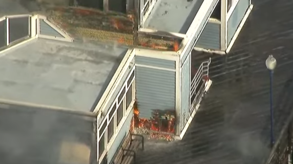 View from helicopter showing structure actively on fire