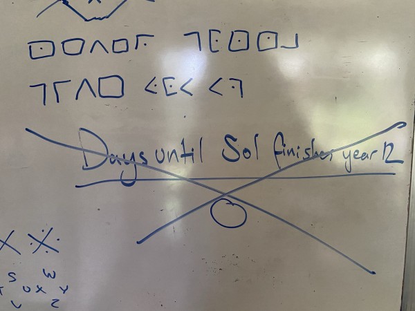 photo of a whiteboard with the words “days until Sol finishes year 12 0” crossed out