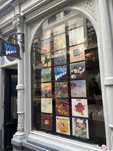 Store window at Waxwell Records Amsterdam with flower themed record covers.