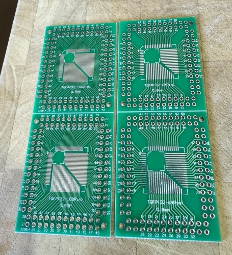 Unpopulated circuit boards. They are designed so that any TQFP IC in either 0.5 or 0.8 pitch and from 32 to 100 (0.5 pitch) or 64 (0.8 pitch) pins can be placed in the same spot