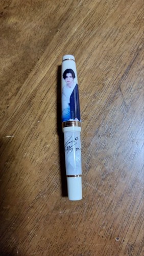 Jinhao 82 mini fountain pen with customized BTS Suga photo print on the cover and his autograph on the barrel.
