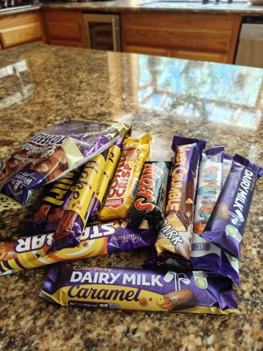 A pile of candy bars on my kitchen counter.