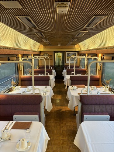 Dining car interior, gleaming in the morning light.