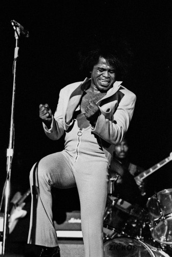 Black and white photo of James Brown in concert