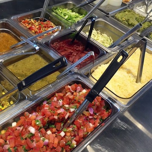An image of the condiment end of the Qdoba line.