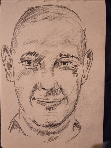 Sketch of my face. Bald person, pretty cheerfull but sad inside.