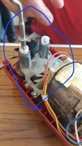 A picture of the inside of a food mixer with the part I need checked